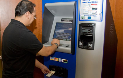 A Customer Pays A Bill At A Chicago EZ Pay Station